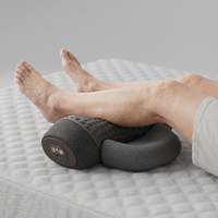 Upper body massager positioned around the neck for home relaxation