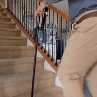 Walking support shown in use with the secondary handle